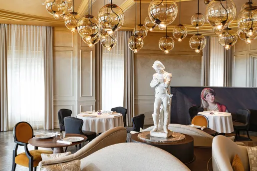 white stone statue in the middle of the dining room