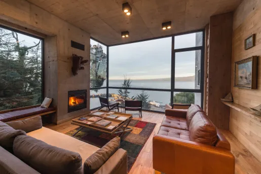 living room with fireplace and large windows