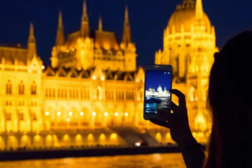 Person taking photo of an illuminated building