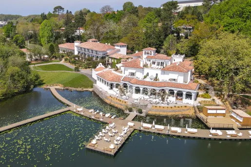 hotel on a dock with boats in the water