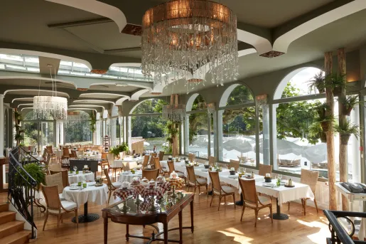 large restaurant dining room with glass chandelier