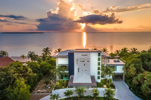Sky view of multi-story building with the sunset in the background