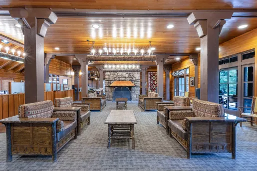 Indoor lobby with couches and furniture made of woode