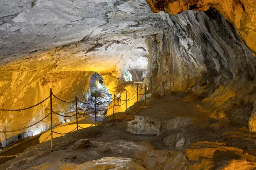 Cave illuminated by orange lights
