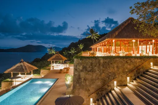 patio overlooking large pool during sunset