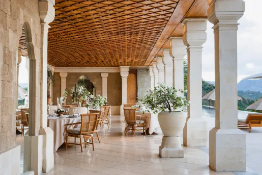 restaurant tables under a large covered patio
