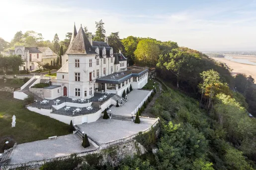 Exterior view of hotel, surrounded by trees