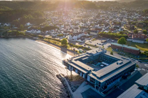 aerial shot of hotel on the water