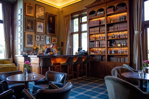 Hotel lobby with bar and bookshelves