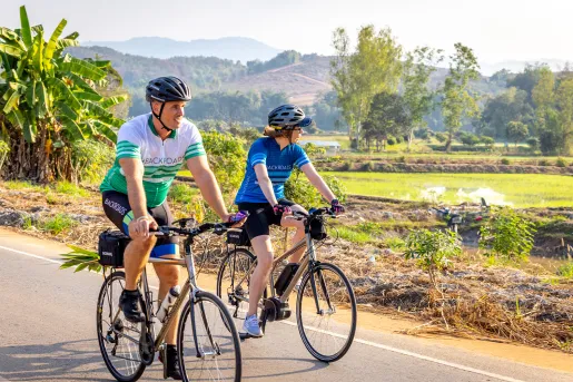 Bikers riding down a road
