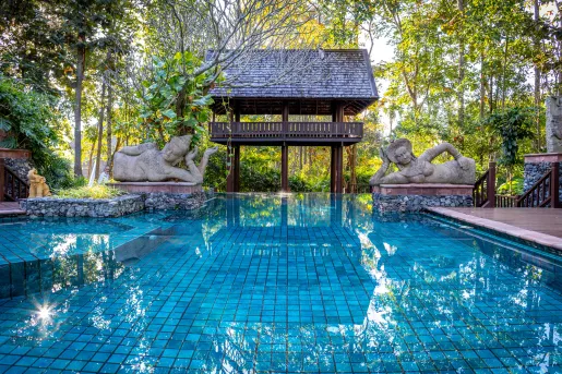 large swimming pool with statues