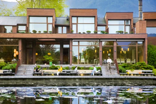 exterior of hotel and deck on the river