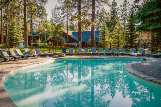Swimming pool surrounded by lounge chairs