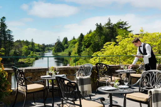 patio with bistro tables overlooking water