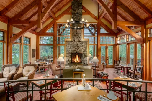 living room with exposed beams and fireplace