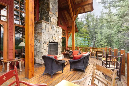wooden deck with furniture and fireplace