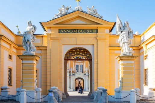 Historic castle with carved statues on a pillar