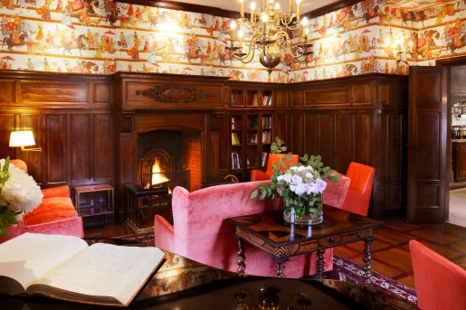 red sofa in front of fireplace