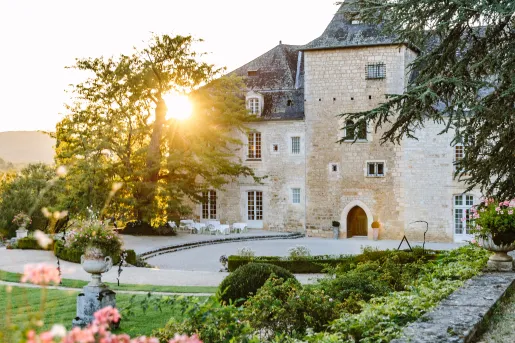 Castle building surrounded by gardens