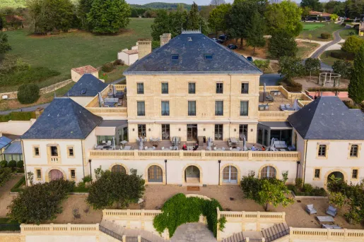 outdoor courtyard of stone hotel building