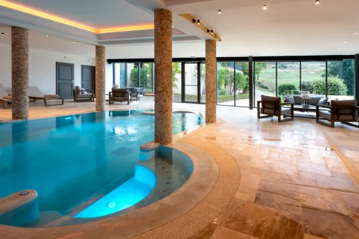 indoor pool with stone pillars