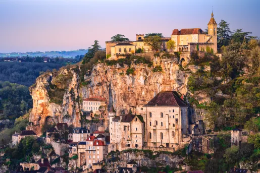 stone buildings along cliffside