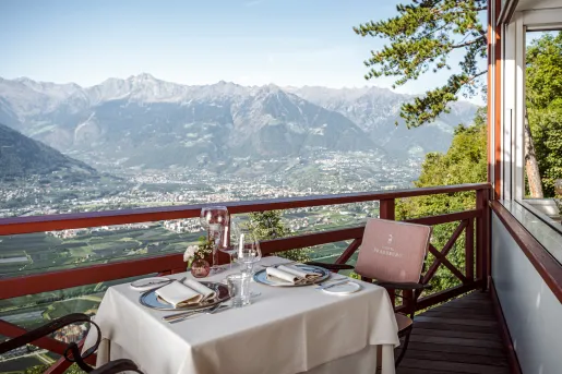 table on balcony with view of mountain range