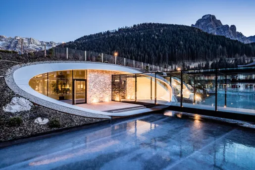 Modern hotel pool entrance with mountains in the background