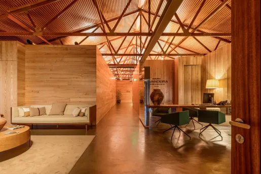 Indoor lobby surrounded by wood veneer walls