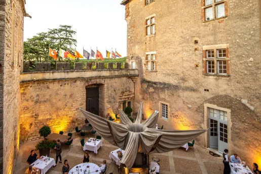 stone outdoor dining area with people eating