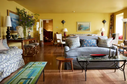 Living room with multiple couches and a marble table