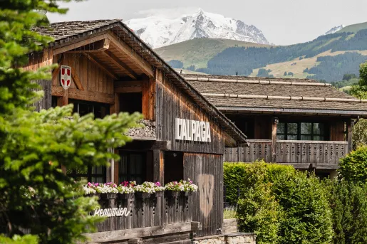 Outdoor view of a wooden building with large open balconies