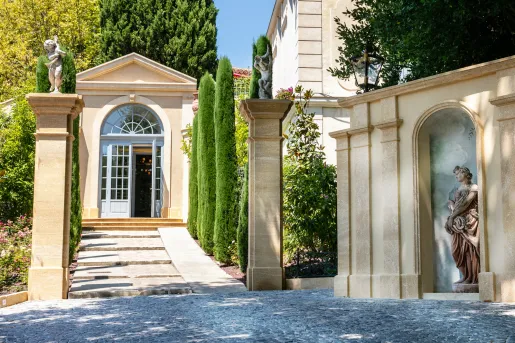 Stone walkways with pillars with statues on top
