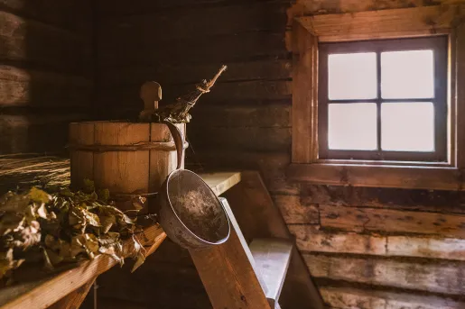 Wooden bucket in a wood cabin