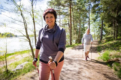 Male and female hiker with walking sticks