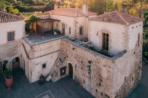 Stone two-story buildings with open courtyards below