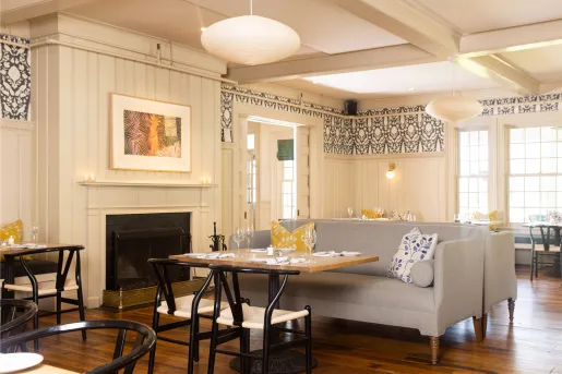 Lounge area with gray sofas in front of a fireplace