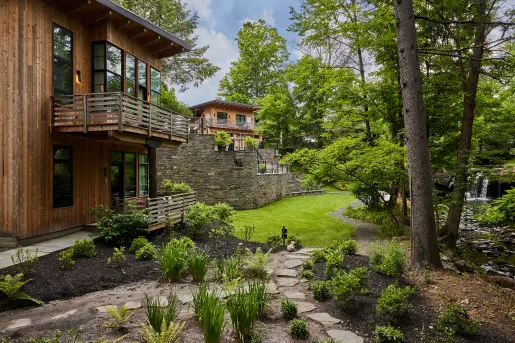 Outdoor courtyard oh building with trees and grass
