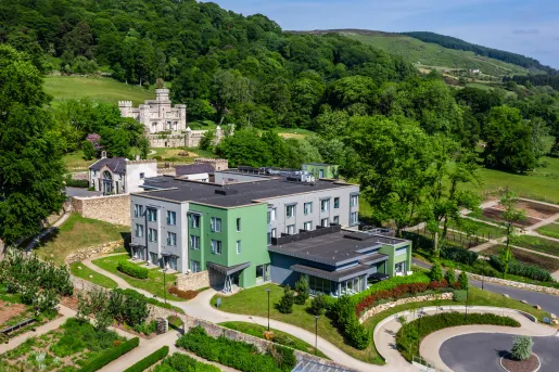 Outdoor view of blue and white building with outdoor patio