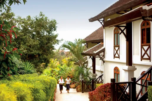 two women walking up the stairs towards hotel