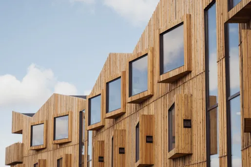 Large windows on the third story of a hotel building