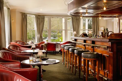 hotel bar with leather chairs and stools