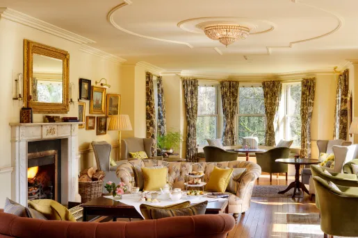 colorful living room with fireplace and big windows