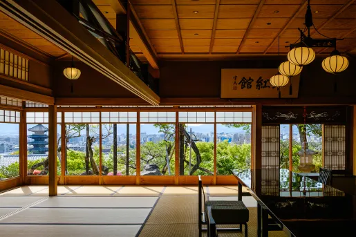 Japanese interior with black shiny tables and tatami mats on the floor
