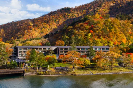Hotel lodged in a heavily forested mountain with colorful foliage