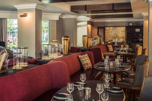 Dining hall with red couches and brown tables