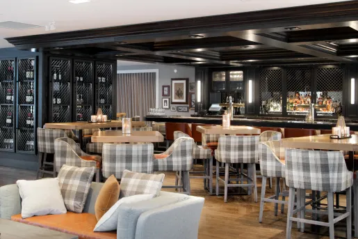 Indoor lounge with to a cage full of wine