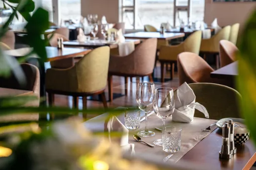 Dining room with two empty wine glasses on the table