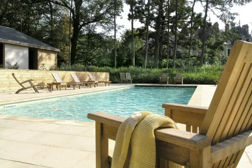 swimming pool with lounge chairs