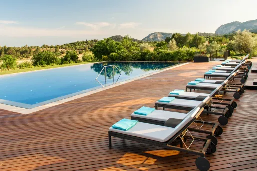 hotel pool with lounge chairs
